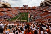 Fans fill Neyland Stadium to form the checkerboard pattern as players take the field of an NCAA college football game between Tennessee and Florida Saturday, Sept. 24, 2022, in Knoxville, Tenn. (AP Photo/Wade Payne)