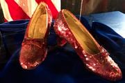 Ruby slippers once worn by Judy Garland in the "The Wizard of Oz" are displayed at a news conference on Sept. 4, 2018, at the FBI office in Brooklyn Center, Minn. Terry Jon Martin, the aging reformed mobster who has admitted stealing the slippers, gave into the temptation of “one last score” after an old mob associate led him to believe the famous shoes must be adorned with real jewels to justify their $1 million insured value according to a new memo filed ahead of his Monday, Jan. 29, 2024, sentencing in Duluth, Minn. (AP Photo/Jeff Baenen, File)