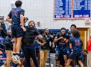 Syracuse Academy of Science's Andre Pasha (15) and his teammates celebrate their close 52-48 victory over Nottingham at Nottingham High School on Friday, Dec 15, 2023