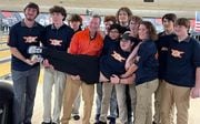 East Syracuse Minoa sophomore Zach Kassel celebrates with teammates after bowling a perfect game on Monday, Jan. 22, 2024, at Strike 'N Spare Lanes in Syracuse.