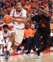 Syracuse Orange guard Judah Mintz (3) drives past  Miami (Fl) Hurricanes guard Bensley Joseph (4). The Syracuse men’s basketball team host the Miami Hurricanes at the JMA Wireless Dome Jan 20, 2024.   (Dennis Nett | dnett@syracuse.com)