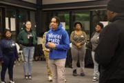 Azi Goodrich stands in the middle of a circle of around 35 Syracuse youth. He asks them personal questions and they take a step forward if it applies to them. Two Syracuse youth talk at their table. The activity was a part of Goodrich's event, What's Good With You?, that aims to connect Syracuse youth together as they work towards their future goals (Melissa Newcomb|mnewcomb@syracuse.com)