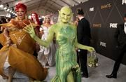Dressed as a green goblin, Princess Poppy from "RuPaul's Drag Race" walks the red carpet at the 75th Emmy Awards on Monday, Jan. 15, 2024 at the Peacock Theater in Los Angeles. (Photo by Mark Von Holden/Invision for the Television Academy/AP Images)