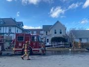 A fire at 403 Bear Street left two residents displaced after a fire spread from the outside, in, firefighters said. Monday, Jan. 15. (Darian Stevenson | dstevenson@syracuse.com)