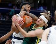 Le Moyne Dolphins guard Nate McClure (35) battles for a rebound against Georgetown Hoyas guard Dontrez Styles (0) at Capital One Arena, Washington, D.C., Tuesday November 7, 2023
Scott Schild | sschild@syracuse.com 


