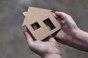 homeless boy holding a cardboard house, dirty hand SYR