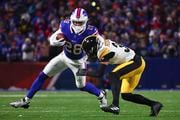 Buffalo Bills running back Latavius Murray (28) carries the ball against Pittsburgh Steelers safety Minkah Fitzpatrick (39) during the third quarter of an NFL wild-card playoff football game, Monday, Jan. 15, 2024, in Buffalo, N.Y. (AP Photo/Jeffrey T. Barnes)