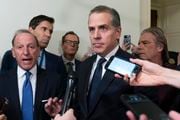 Hunter Biden, President Joe Biden's son, accompanied by his attorney Abbe Lowell, left, talks to reporters as they leave a House Oversight Committee hearing as Republicans are taking the first step toward holding him in contempt of Congress, Wednesday, Jan. 10, 2024, on Capitol Hill in Washington.  (AP Photo/Jose Luis Magana)