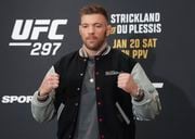 DraftKings' promo code unlocks a package of welcome bonuses for UFC 297 betting and also includes a daily SGP no-sweat bet token, and expires February 11th. (Nathan Denette/The Canadian Press via AP)