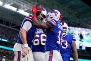 MIAMI GARDENS, FLORIDA - JANUARY 07: Trent Sherfield #16 of the Buffalo Bills celebrates with Josh Allen #17 after a touchdown during the second quarter against the Miami Dolphins at Hard Rock Stadium on January 07, 2024 in Miami Gardens, Florida. (Photo by Rich Storry/Getty Images)