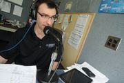 This 2013 file photo shows Syracuse Chiefs play-by-play radio announcer Jason Benetti in the NBT Stadium broadcast booth.