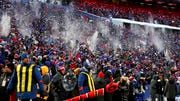 Buffalo Bills fans throw snow in the air after the Bills scored a touchdown against the Pittsburgh Steelers during the first quarter of an NFL wild-card playoff football game, Monday, Jan. 15, 2024, in Buffalo, N.Y. (AP Photo/Jeffrey T. Barnes)