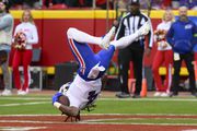 A Buffalo Bills player somersaults into the end zone for a touchdown against the Kansas City Chiefs during the first half of an NFL football game, Sunday, Dec. 10, 2023 in Kansas City, Mo. (AP Photo/Reed Hoffmann)