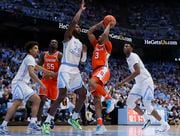 Syracuse Orange guard Judah Mintz (3) gets challenged by North Carolina Tar Heels forward Jae'Lyn Withers (24) at the goal as Syracuse men’s basketball played UNC Tar Heels in Chapel Hill Saturday, January 13, 2024. (N. Scott Trimble | strimble@syracuse.com)