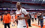 Syracuse Orange guard Quadir Copeland (24) runs off the court with his cell phone after his game winning shot. The Syracuse men’s basketball team host the Miami Hurricanes at the JMA Wireless Dome Jan 20, 2024.   (Dennis Nett | dnett@syracuse.com)