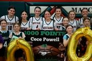 Marcellus’ Cecilia Powell, center of banner, celebrates scoring her 1,000th point vs. Phoenix with her teammates. Girl’s basketball at Marcellus High School, Marcellus, N.Y., Friday January 19, 2024
(Scott Schild | sschild@syracuse.com)   

