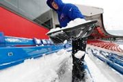 Joseph Dimmig Lancaster shovels snow in stands before an NFL football game between the Buffalo Bills and the Indianapolis Colts, Sunday, Dec. 10, 2017, in Orchard Park, N.Y. (AP Photo/Jeffrey T. Barnes)