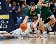 Le Moyne Dolphins forward Luke Sutherland (23) collects a turnover against the Georgetown Hoyas at Capital One Arena, Washington, D.C., Tuesday November 7, 2023
Scott Schild | sschild@syracuse.com 


