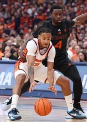 Syracuse Orange guard Judah Mintz (3) briefly loses the handler on the bal with Miami (Fl) Hurricanes guard Bensley Joseph (4) defending. . The Syracuse men’s basketball team host the Miami Hurricanes at the JMA Wireless Dome Jan 20, 2024.   (Dennis Nett | dnett@syracuse.com)