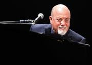 Billy Joel performs to a near sellout crowd at the Carrier Dome, Syracuse, N.Y., Friday March 20, 2015. Scott Schild | sschild@syracuse.com