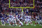 FILE - In this Jan. 27, 1991, file photo, Buffalo Bills kicker Scott Norwood, center, misses a field goal on the last play of the game, clinching the 20-19 victory for the New York Giants in Super Bowl XXV in Tampa, Fla. Despite the most famous miss in NFL history, Norwood was treated well by most Bills fans. They chanted his name until he addressed the crowd at a rally in Buffalo days after the loss. (AP Photo/Phil Sandlin, File)