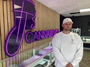 TJ Lewis stands inside the TJ's Cannabis shop at 4205 Long Branch Road in Clay. Although he received a preliminary state  license to sell weed in May, he, like many others, is still waiting for the final OK to open.
