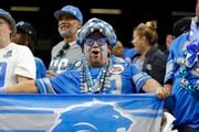The Detroit Lions Fan of the Year cheers from the stands during an NFL football game against the New Orleans Saints, Sunday, Dec. 3, 2023, in New Orleans. (AP Photo/Tyler Kaufman)