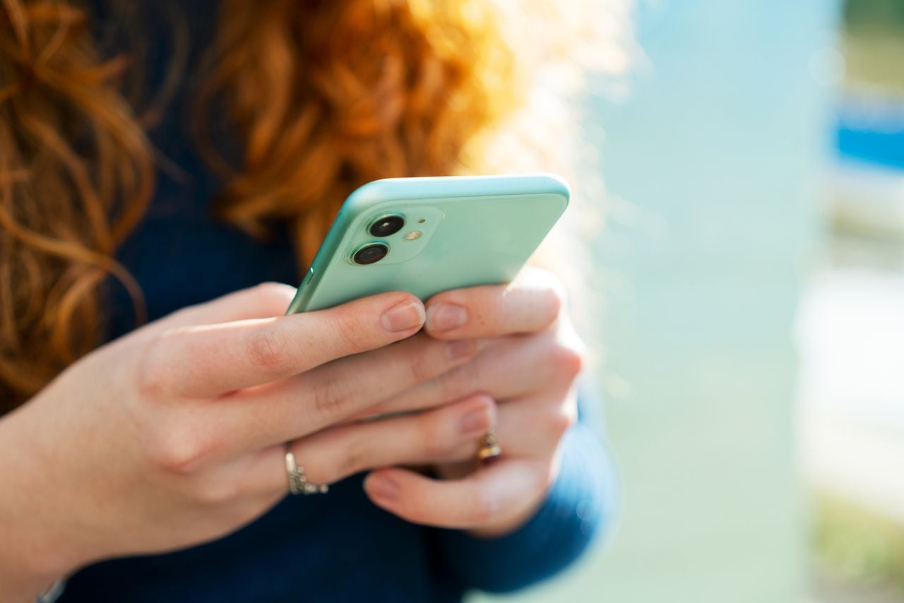 Woman using smartphone.