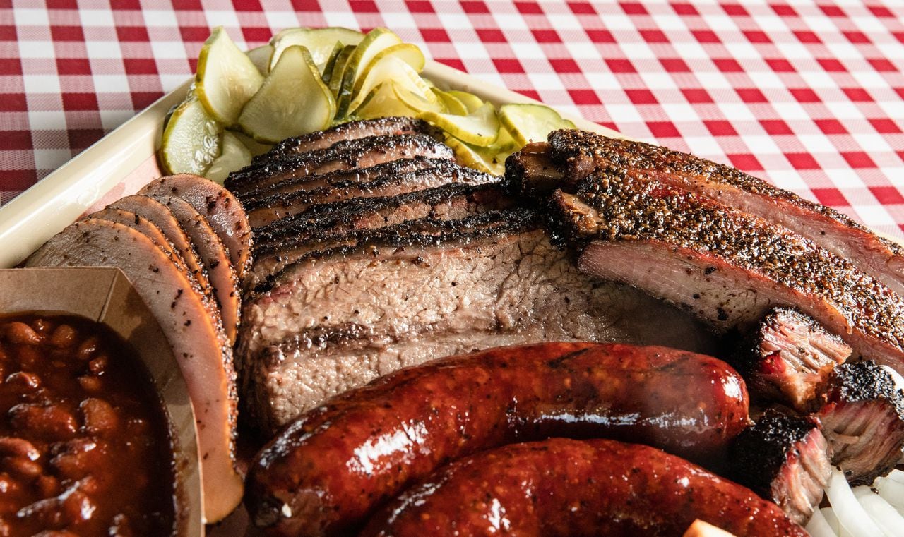 A plate of Texas barbecue sits atop a table. There is a variety of food available for purchase at the 2024 Fort Worth Stock Show and Rodeo, including Texas barbecue.