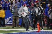 Buffalo Bills head coach Sean McDermott runs to the end zone after throwing a challenge flag during an NFL divisional round playoff football game, Sunday, Jan. 21, 2024 in Orchard Park, NY. (AP Photo/Matt Durisko)