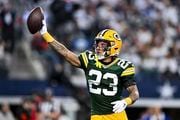 Green Bay Packers cornerback Jaire Alexander (23) reacts after intercepting a pass by Dallas Cowboys quarterback Dak Prescott, not pictured, during the first half of an NFL football game Sunday, Jan. 14, 2024 in Arlington, Texas. (AP Photo | Maria Lysaker)