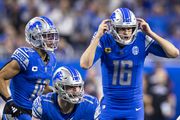 Detroit Lions quarterback Jared Goff (16) calls an audible during the NFL divisional round playoff game at Ford Field in Detroit on Sunday, Jan. 21, 2024. 