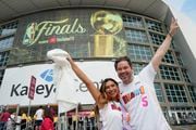 Cathy Olmos and Camilo Barreto of Miami, waits to enter the Kaseya Center for Game 3 of the NBA Finals basketball game between the Miami Heat and the Denver Nuggets, Wednesday, June 7, 2023, in Miami. (AP Photo/Rebecca Blackwell)