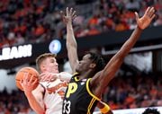 Syracuse forward Justin Taylor goes up against Pittsburgh center Federiko Federiko in the teams' first meeting on Dec. 30, 2023 at the JMA Wireless Dome. Syracuse won the first meeting 81-73. Dennis Nett | dnett@syracuse.com