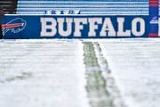 FILE - Snow covers the field at Highmark Stadium before an NFL football game between the Atlanta Falcons and Buffalo Bills in Orchard Park, N.Y., on Sunday, Jan. 2, 2022. The NFL is monitoring the weather and has contingency plans in place in the event a lake-effect snowstorm hitting the Buffalo disrupts the Bills ability to host the Cleveland Browns on Sunday, Nov. 20, 2022. (AP Photo/Adrian Kraus, File)