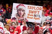 A sign referring to Taylor Swift is seen in the stands during the first half of a Kansas City Chiefs NFL football game, Monday, Dec. 25, 2023, in Kansas City, Mo. (AP Photo/Ed Zurga)